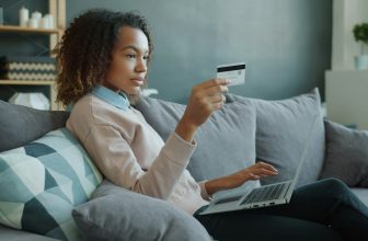 Online shopper using a laptop and payment card